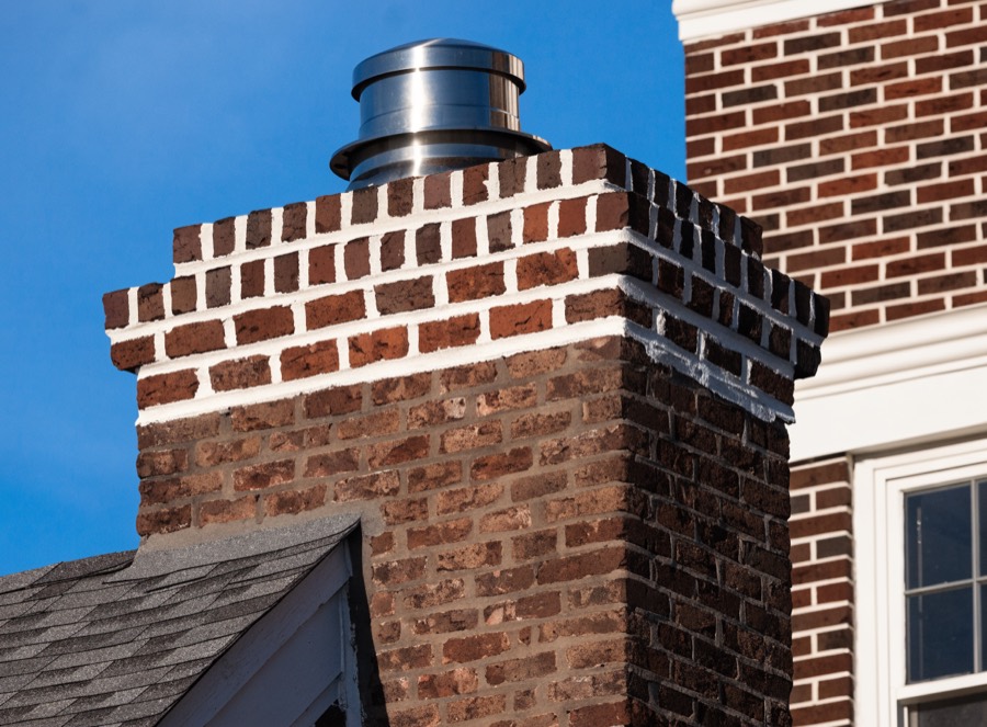 Rebuilt brick chimney crown on a Baltimore county home